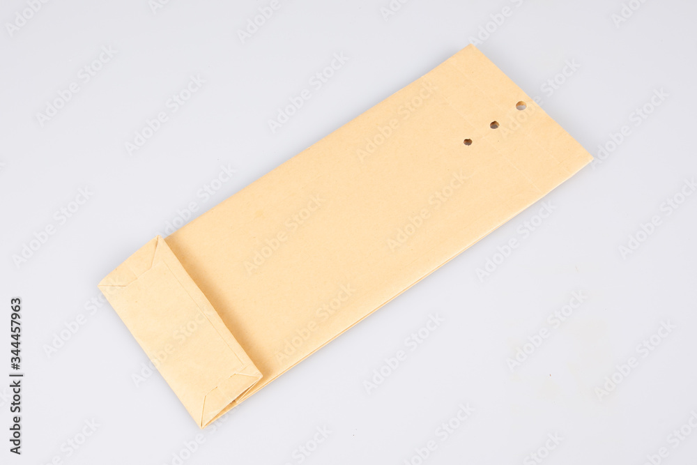 Kraft small brown paper square perforated closure envelope isolated Kraft small brown paper square perforated closure envelope isolated