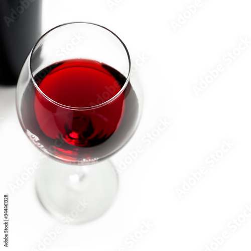 Glasses of red wine on white background.