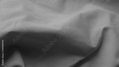 soft folds of fabric, black-gray background for design