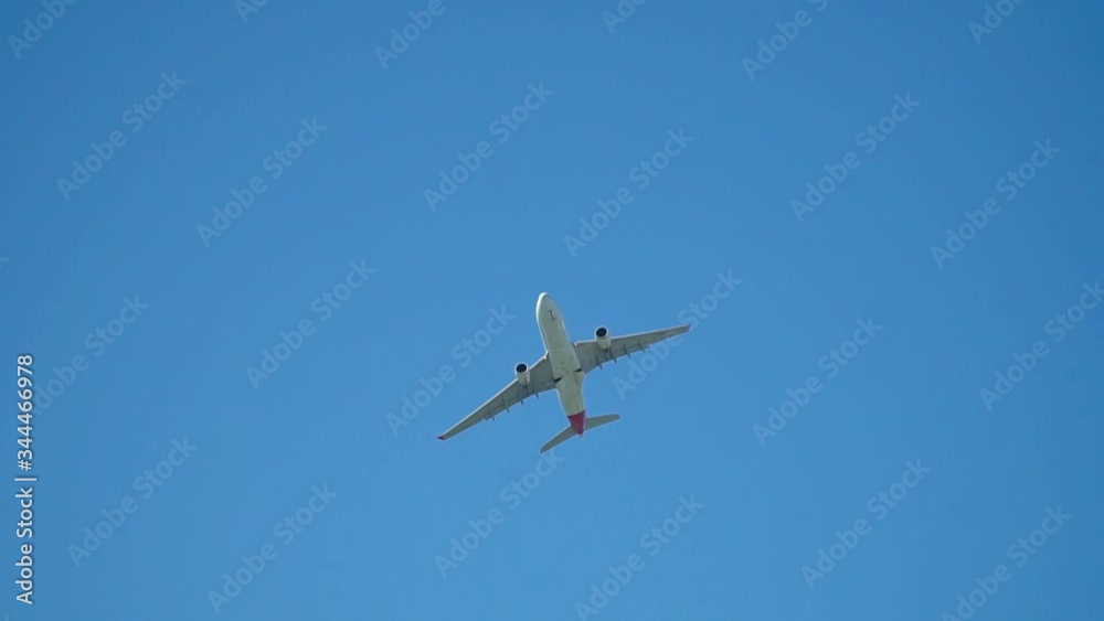 Large plane take off day. A large passenger airliner is taking of during a beautful sunny day. Slow motion close up. Large plane take off day. A large passenger airliner is taking of during a beautful sunny day. Slow motion close up.