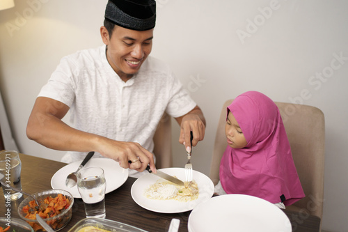 muslim family dinner break fasting together at home during ramadan