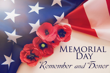 American flag and a poppy flowers with Memorial Day Remember and Honor text background	