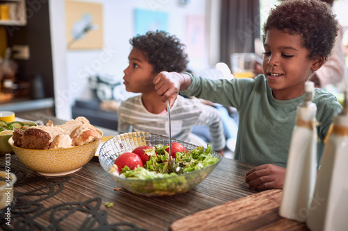 afro-american kids eating healthy food together. brother and sister. togetherness concept photo