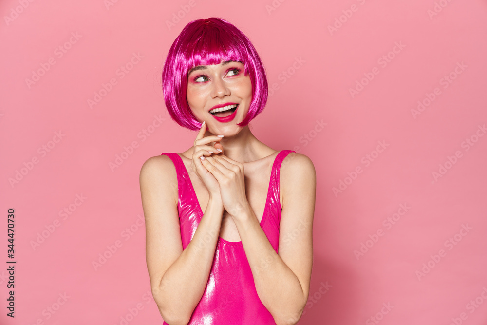 Image of happy beautiful woman in wig smiling and looking aside