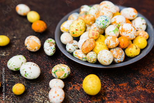 multicolored candy jelly beans caramel in the shape of small Easter eggs photo