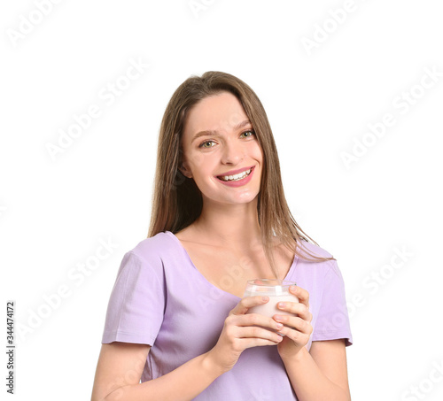 Young woman with tasty yogu...