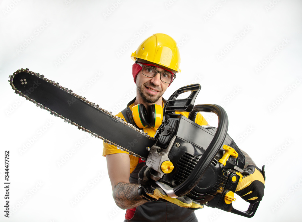 a guy in protective coveralls with a chainsaw on a white background a guy in protective coveralls with a chainsaw on a white background
