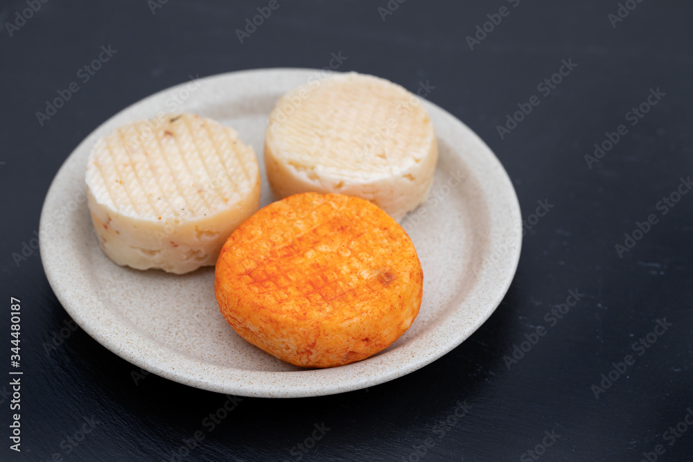 various cheese on gray ceramic background