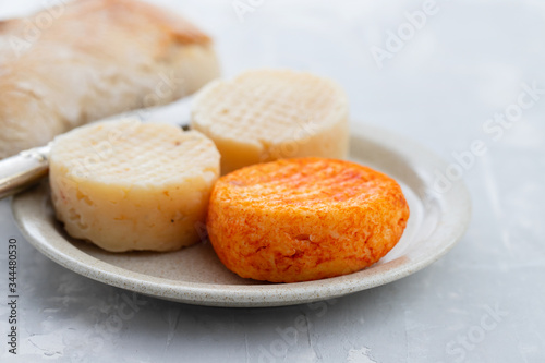 various cheese on gray ceramic background