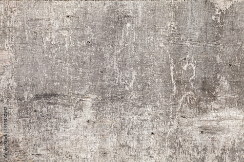 Old used gray grungy plywood sheet, background photo