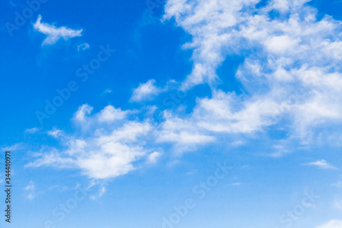 Fototapeta Naklejka Na Ścianę i Meble -  White altocumulus clouds in a blue sky at daytime