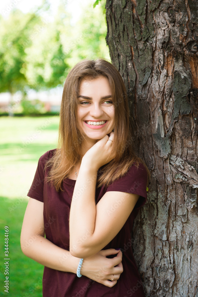 Attractive young woman enjoying her time outside in the park.