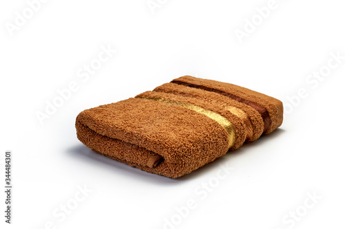 clean, soft brown towel on a white background, bathroom, hygiene