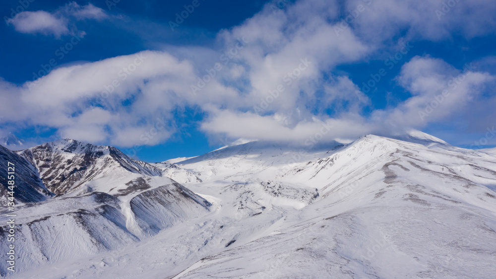 Beautiful view of Avachinskiy Volcanonear Petropavlovsk-Kamchatskiy city. Active volcano. Drone photo. Picturesque photo for a magazine. Kamchatka peninsula. Russia Beautiful view of Avachinskiy Volcanonear Petropavlovsk-Kamchatskiy city. Active volcano. Drone photo. Picturesque photo for a magazine. Kamchatka peninsula. Russia