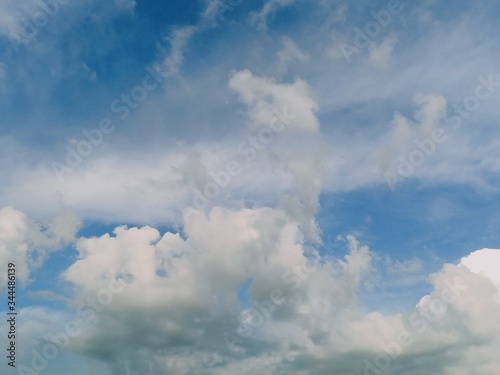 black and white clouds with blue sky