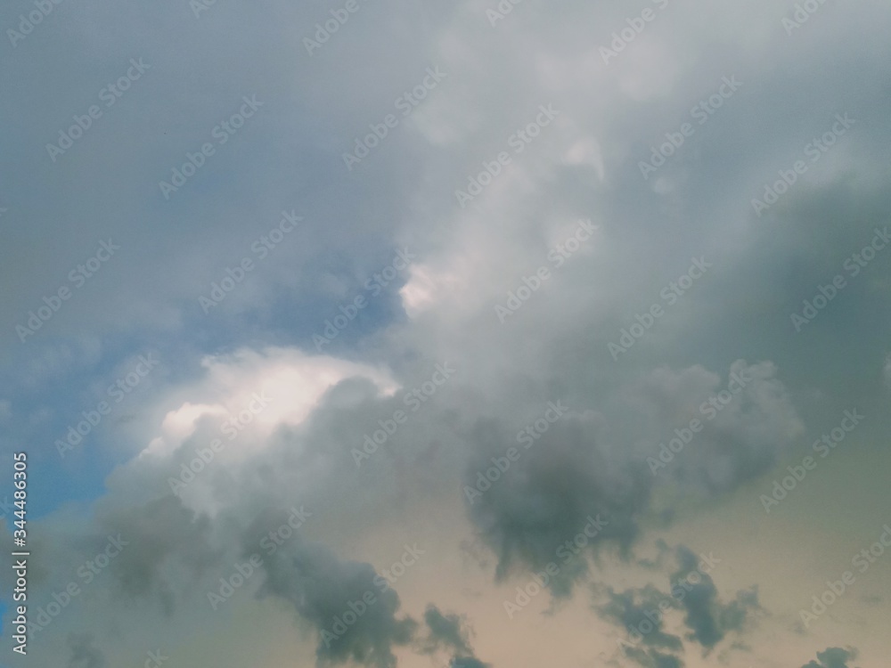 black and white clouds with blue sky