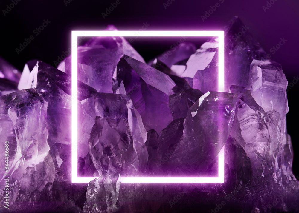 Creative fluorescent layout made of crystal. Neon light flat square frame  on transparent purple amethyst crystal, dark purple colors, copy space for  poster, sale advertisement, banner, card, wedding i Stock Photo