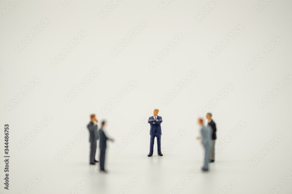 Businessman miniature people figure standing discuss with teamwork on white background with copy space. Businessman miniature people figure standing discuss with teamwork on white background with copy space.