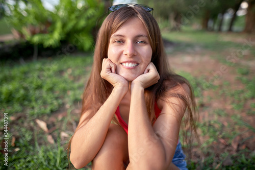  portrait of a happy girl on a background of nature 