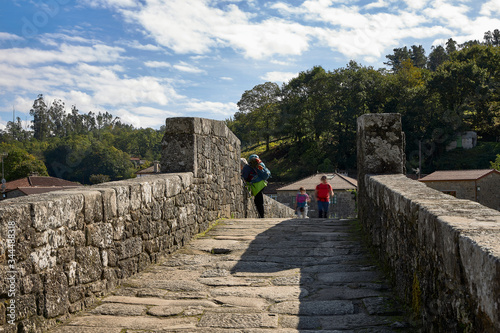 Puente de piedra sobre el río Tambre en el Camino de Santiago
El último tramo del Camino de Santiago de Composela lleva a los peregrinos hasta Finisterre, en la Costa de la Muerte.  photo