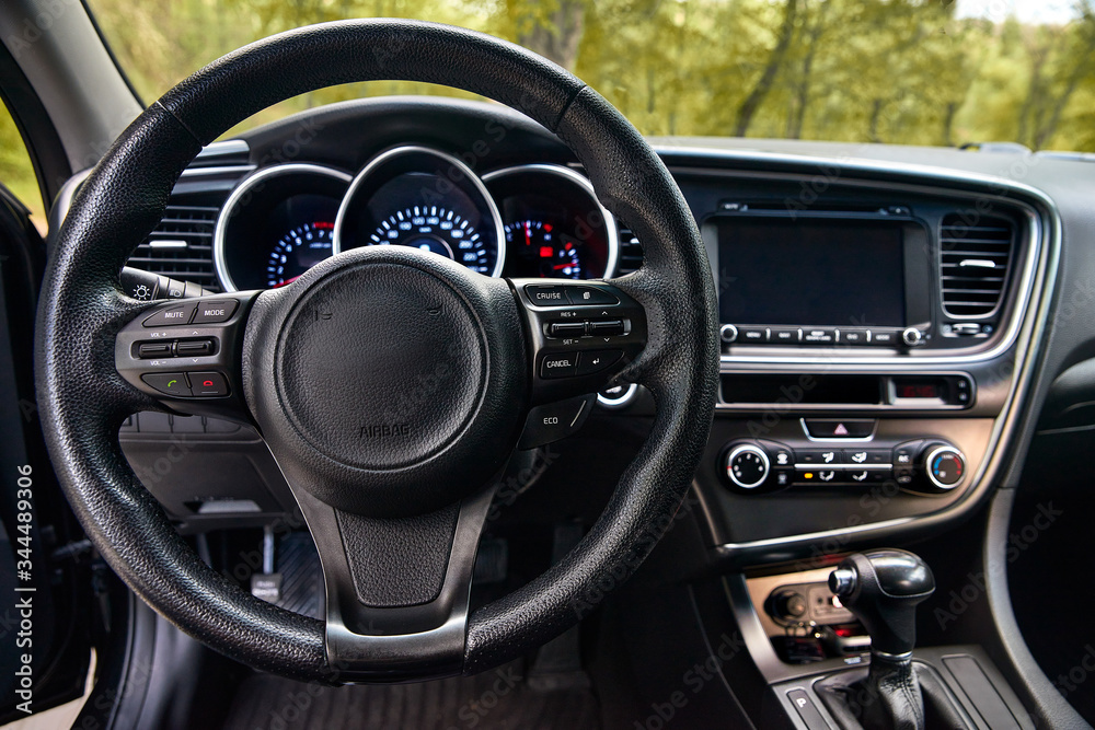 car dashboard and steering wheel, modern car interior design