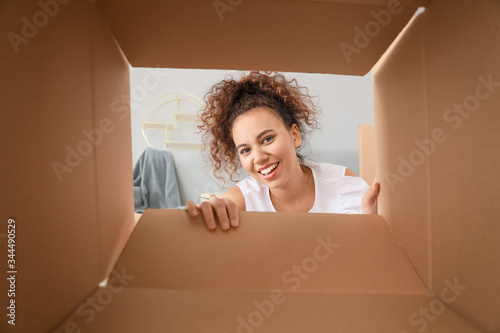 Happy woman with open box, ...
