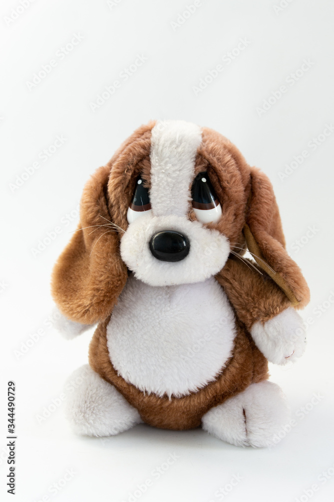 plush dog toy on a white background