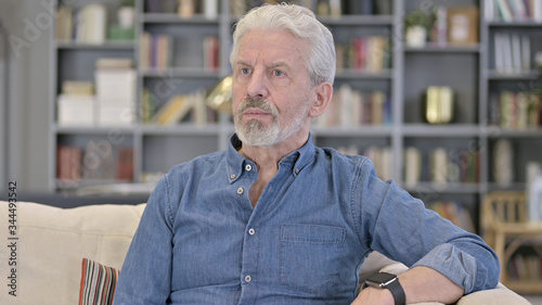 Portrait of Impatient Senior Man Looking at Smartwatch