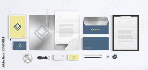 Vector corporate branding for technical company with blue geometrical logo and bright yellow background. Stationery mockup template set.