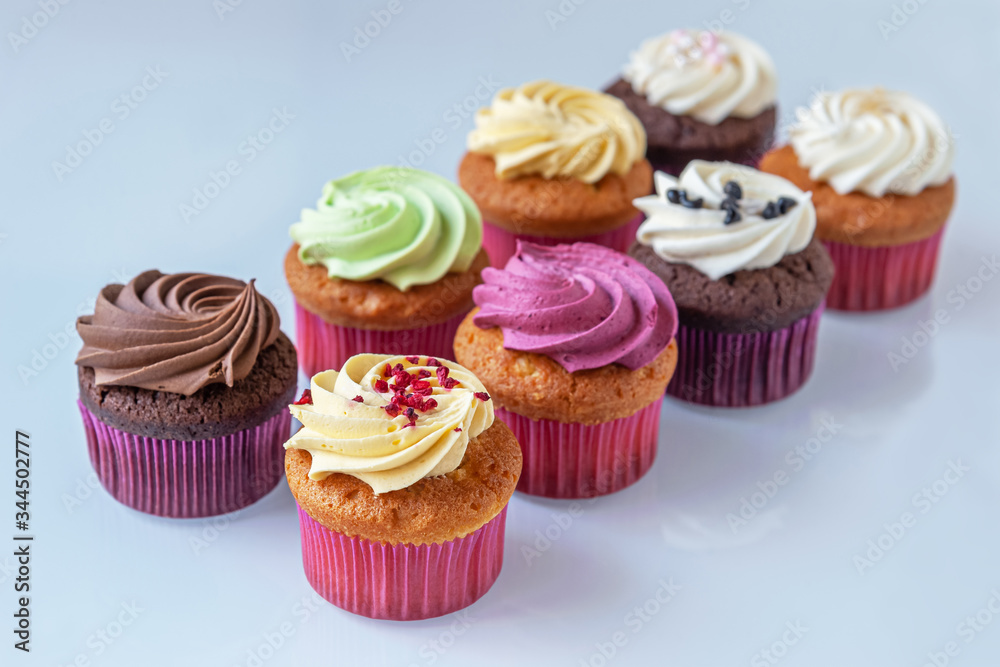 different cupcakes on a light glass surface