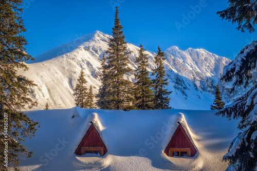 Przysypana śniegiem chata na Hali Gąsienicowej photo