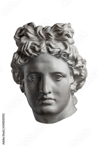 White gypsum copy of ancient statue of Apollo God of Sun head for artists on a white background. Plaster sculpture of man face. Renaissance epoch. Portrait.