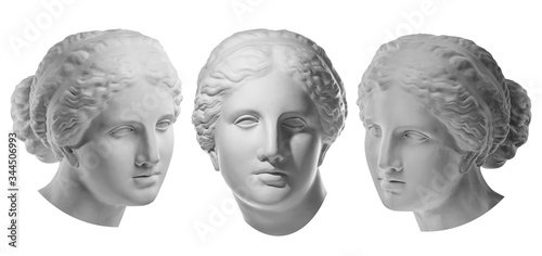 Three gypsum copy of ancient statue Venus head isolated on white background. Plaster sculpture woman face. photo