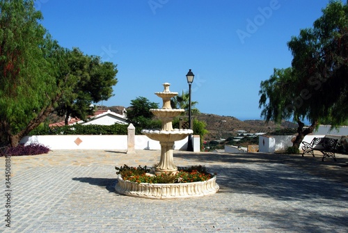 Fountain in a small plaza in the white village (pueblo blanco), Macharaviaya, Andalusia, Spain.