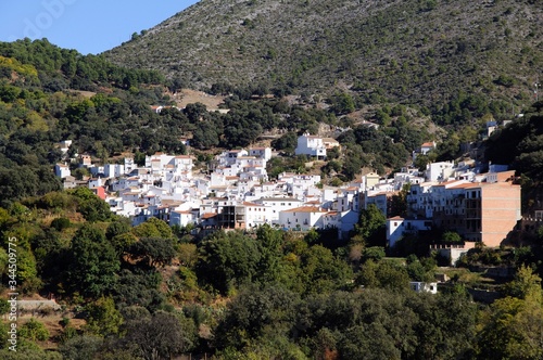 View of whitewashed village and surrounding countryside, Igualeja, Andalusia, Spain. © arenaphotouk