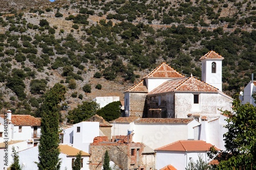 Church and townhouses in the centre of the village, Parauta, Andalusia, Spain. photo