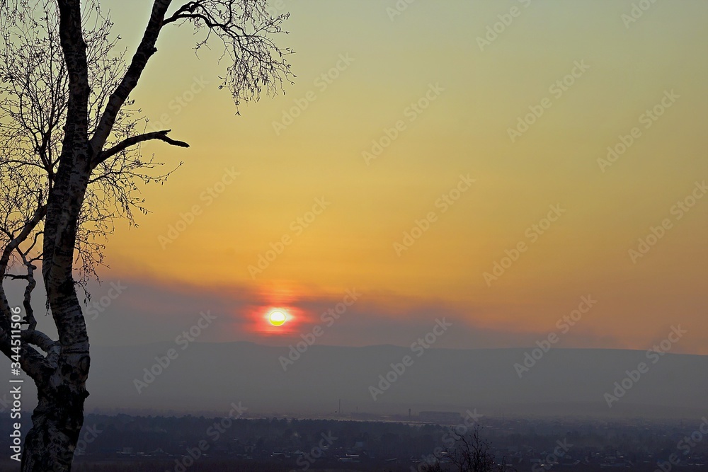 Sunset over the valley in a haze. Sunset over the valley in a haze.