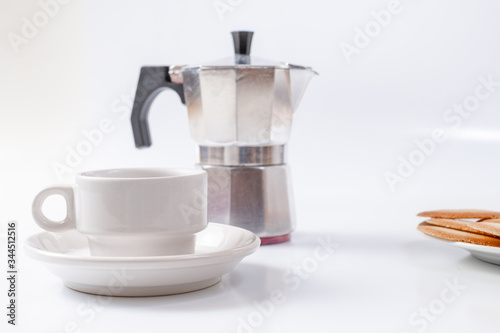 coffee maker white breakfast cup and cookies on background