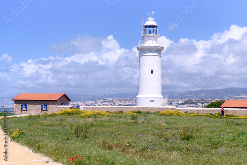 Lighthouse white against the blue sky. Symbol of hope and faith in the future