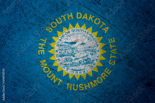 Flag of south dakota, USA, on a grunge metal texture