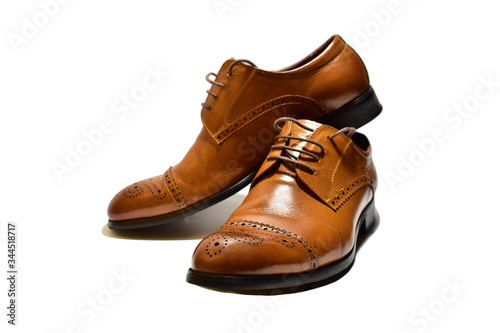 brown men's classic shoes on a white background. isolate closeup