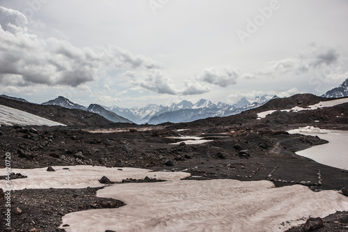 high mountains covered with snow and ice, peaks and valleys in the Caucasus