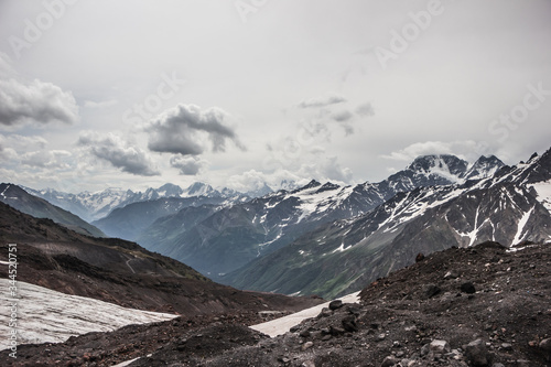 high mountains covered with snow and ice, peaks and valleys in the Caucasus