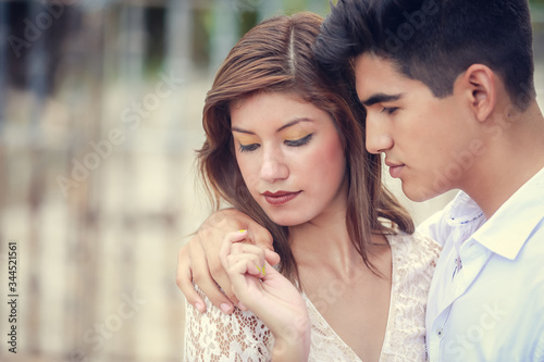 Obraz na płótnie Beautiful sensual portrait of young stylish passionate couple hugging in summer park outdoors