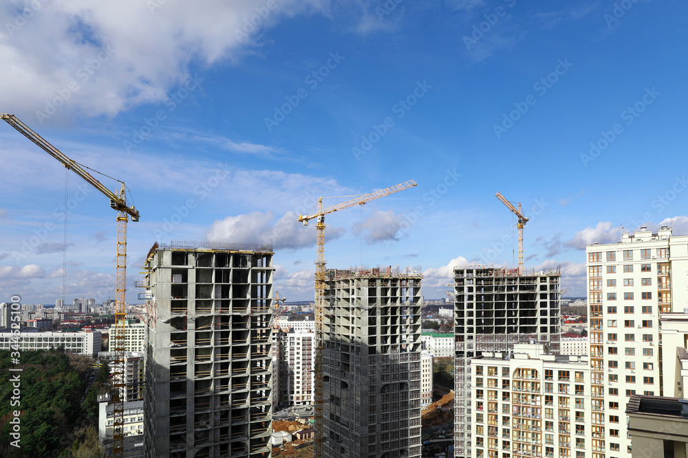 City panorama, construction site with cranes