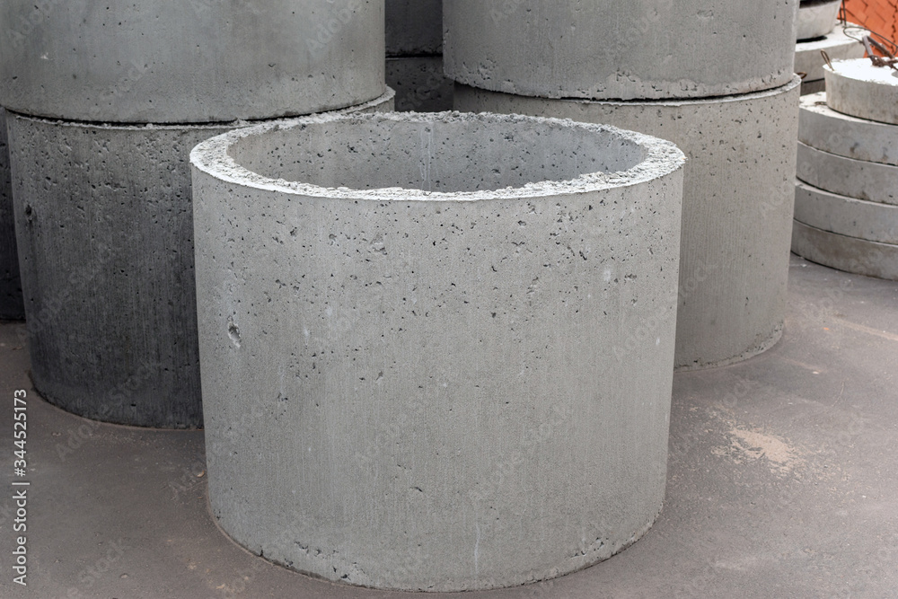 new round sewer concrete rings for sewage. sale of building materials in the open air