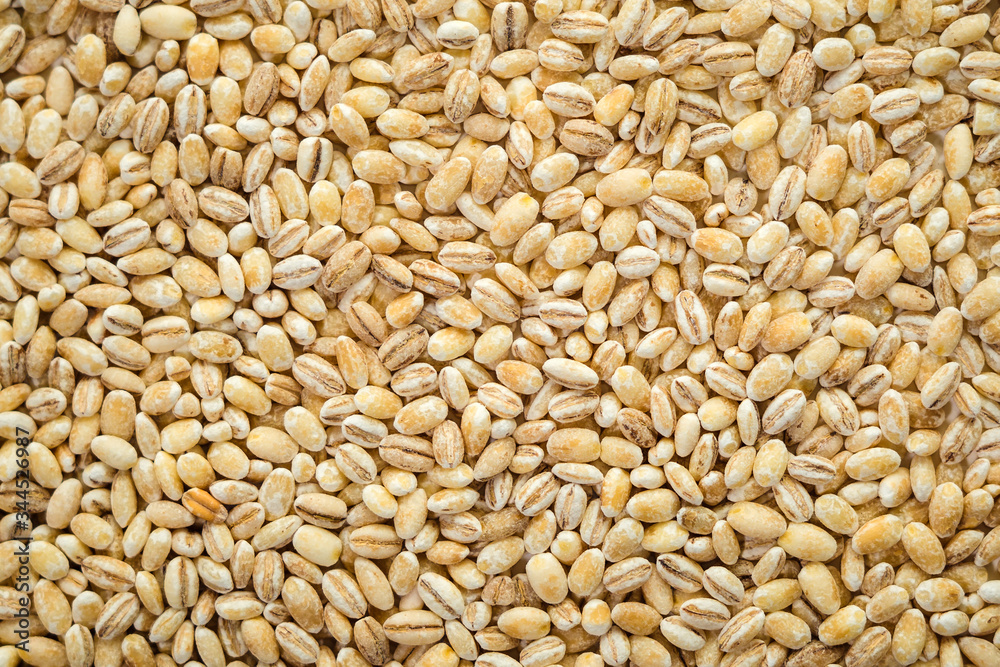Barley grits, close up as natural food background Barley grits, close up as natural food background