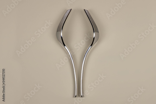 Glass of wine made with forks. Concept of wine. Minimalism copy space