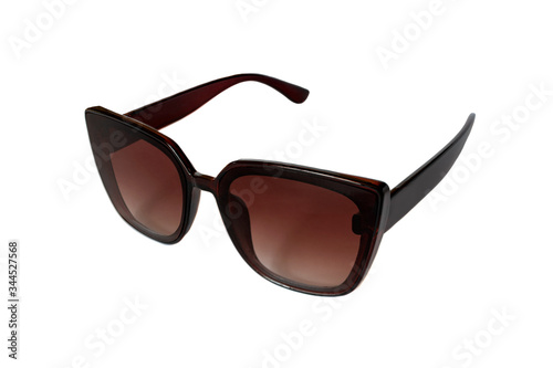 female black sunglasses on a white background close-up. isolate