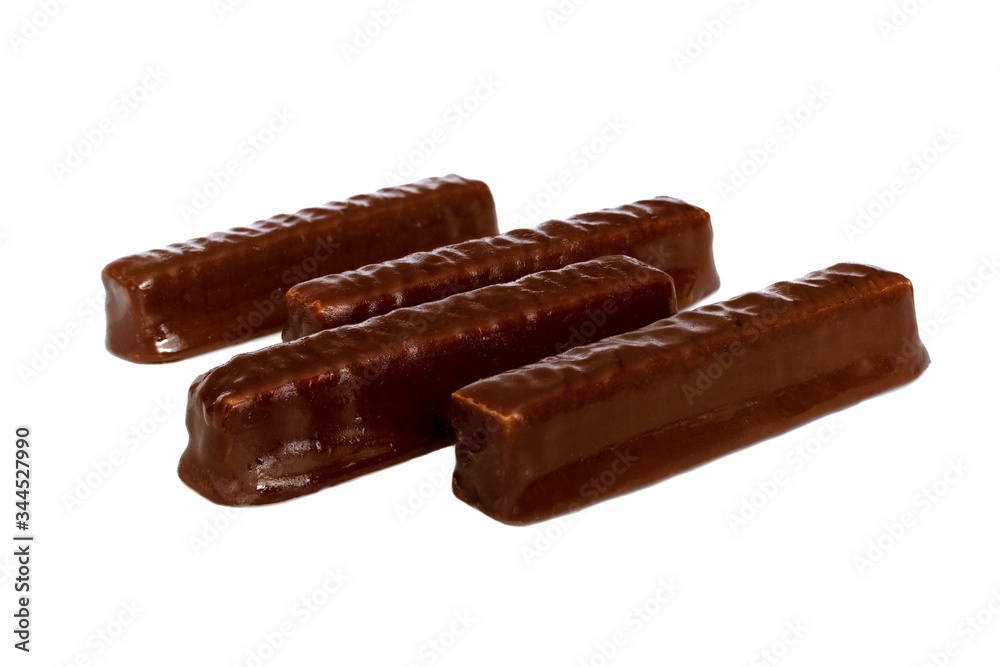 Dessert for tea. sweet brown chocolate wafers with caramel on a white background. isolate Dessert for tea. sweet brown chocolate wafers with caramel on a white background. isolate